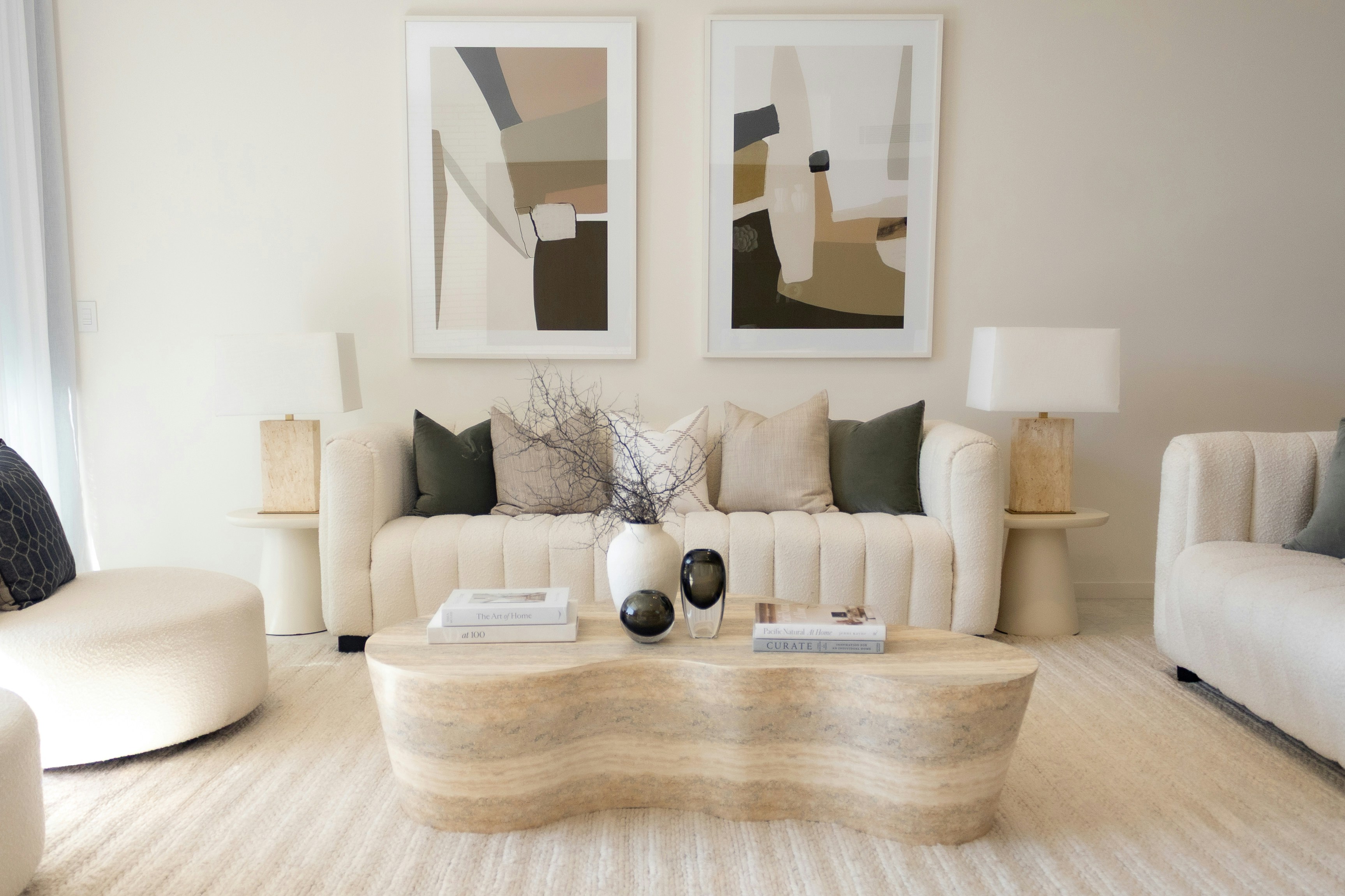 Elegant neutral living room with sofa, artwork and natural styling