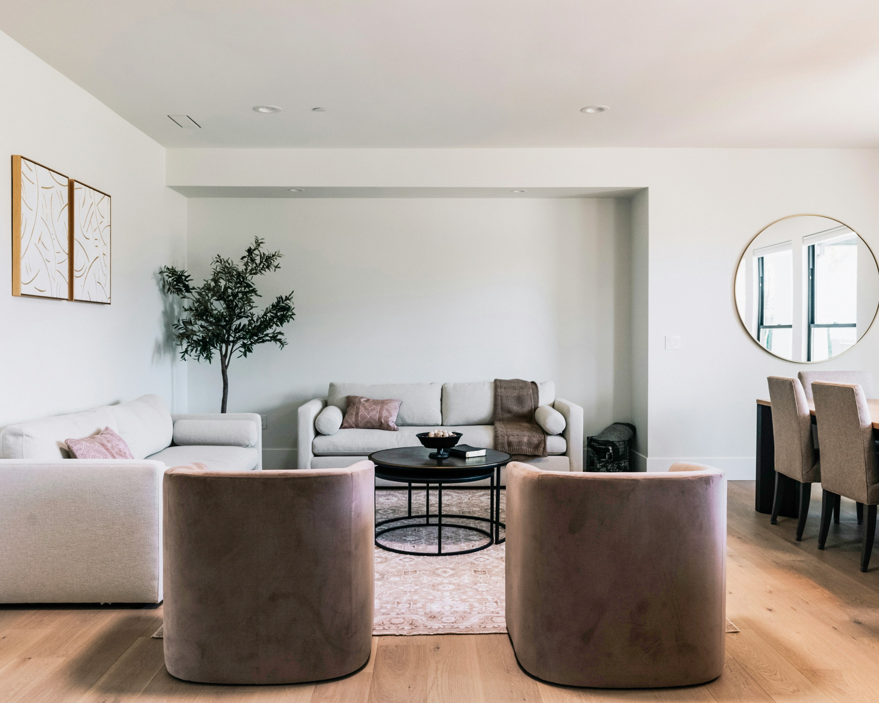 Modern living room with neutral sofas and minimalist furniture