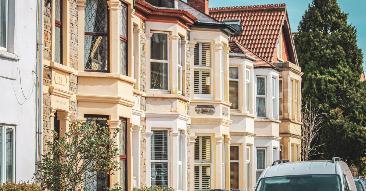Elegant row houses with classic architecture on a sunny street in Bristol, UK.